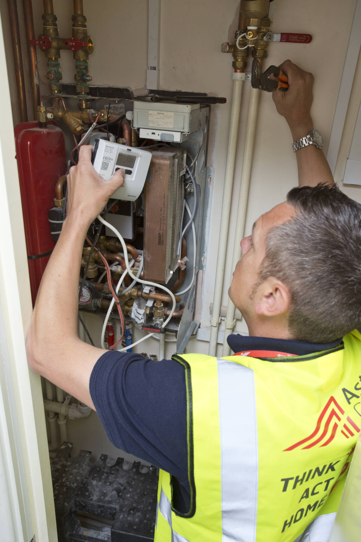 Gas engineer at work in a hi vis jacket