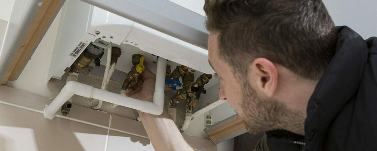 Engineer checking a boiler gas safety week